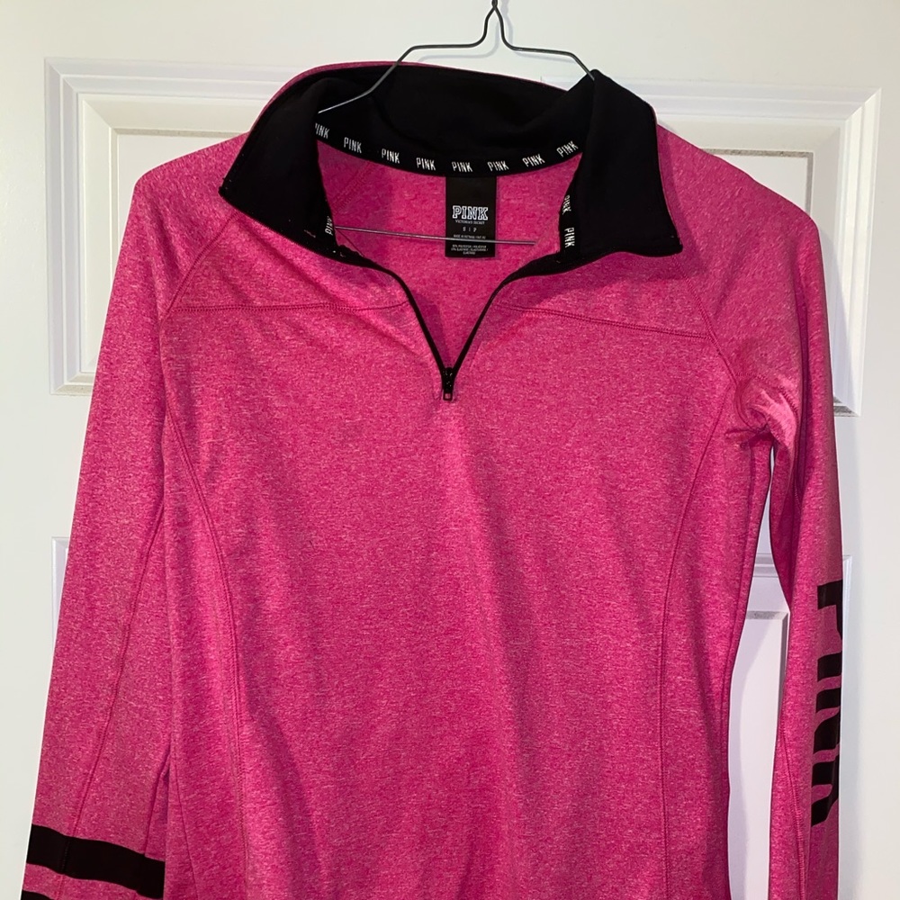 Pink athletic wear long sleeve pink shirt.